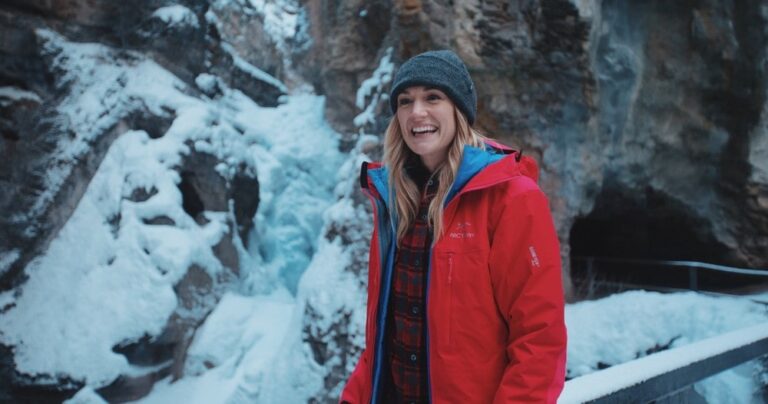 woman smiling on johnston canyon frozen falls guided tour
