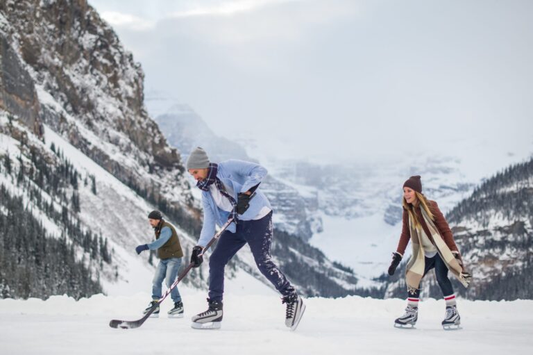 group playing ice hockey on lake louise