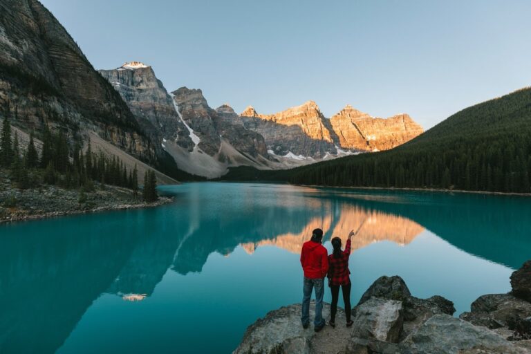couple taking in sunset at moraine lake