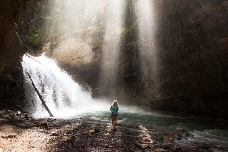 woman in front of waterfall
