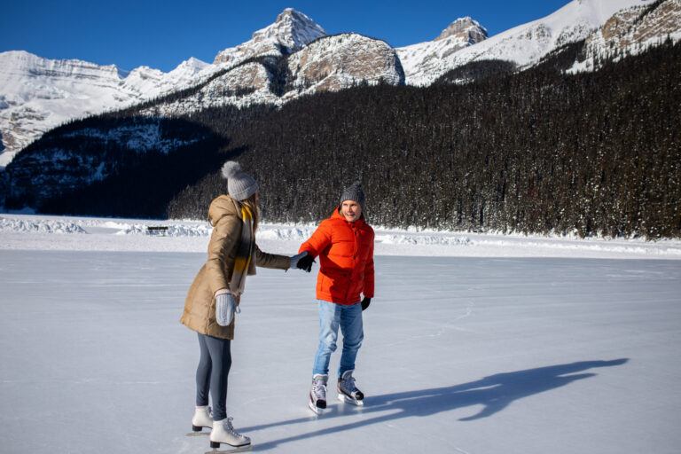 couple ice skating lake louise
