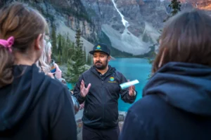 Radventures tour guide with guests at Moraine Lake Rock Pile viewpoint