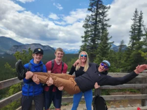 Radventures guests posing at Hoodoo viewpoint in Banff