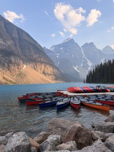 Sunset at Moraine Lake shoreline trail and conoe docks