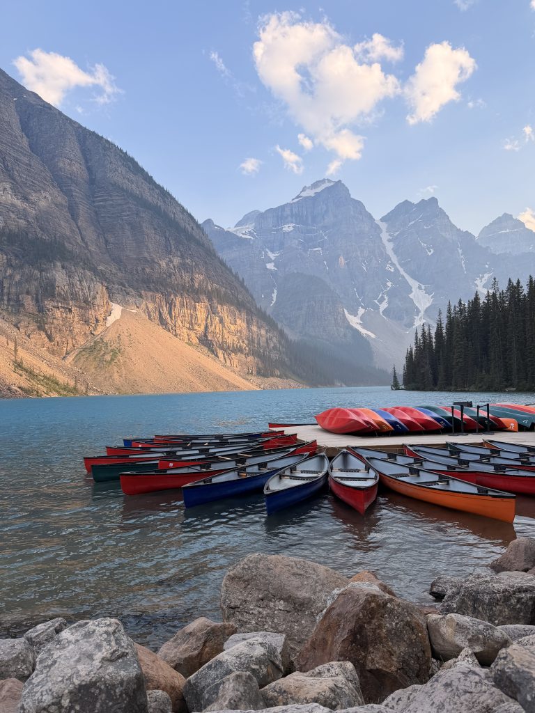 Sunset at Moraine Lake shoreline trail and conoe docks